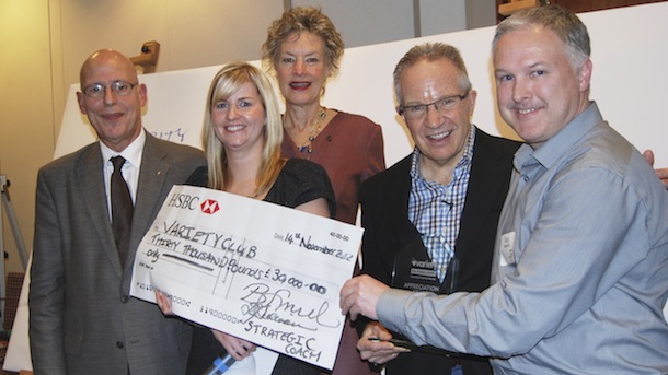 Andrea Dempsey, Babs Smith, and Dan Sullivan of Strategic Coach present a cheque to Variety Village U.K. for £30,000.